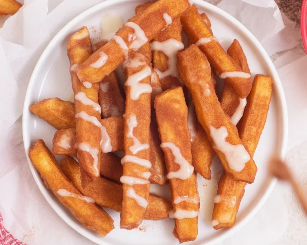 Crispy Air Fryer Apple Fries coated in cinnamon sugar, perfect for a tasty snack.