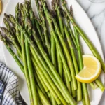 Delicious air fryer asparagus cooked to perfection with olive oil and spices.